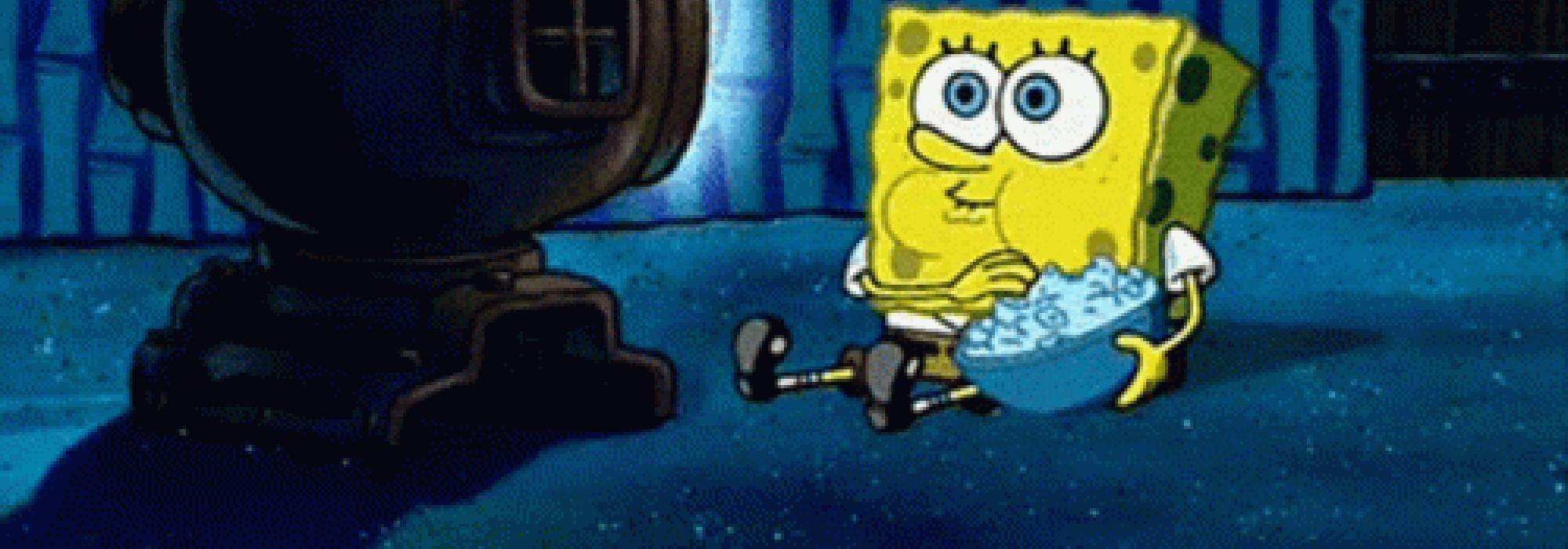 Spongebob on the floor eating popcorn watching TV